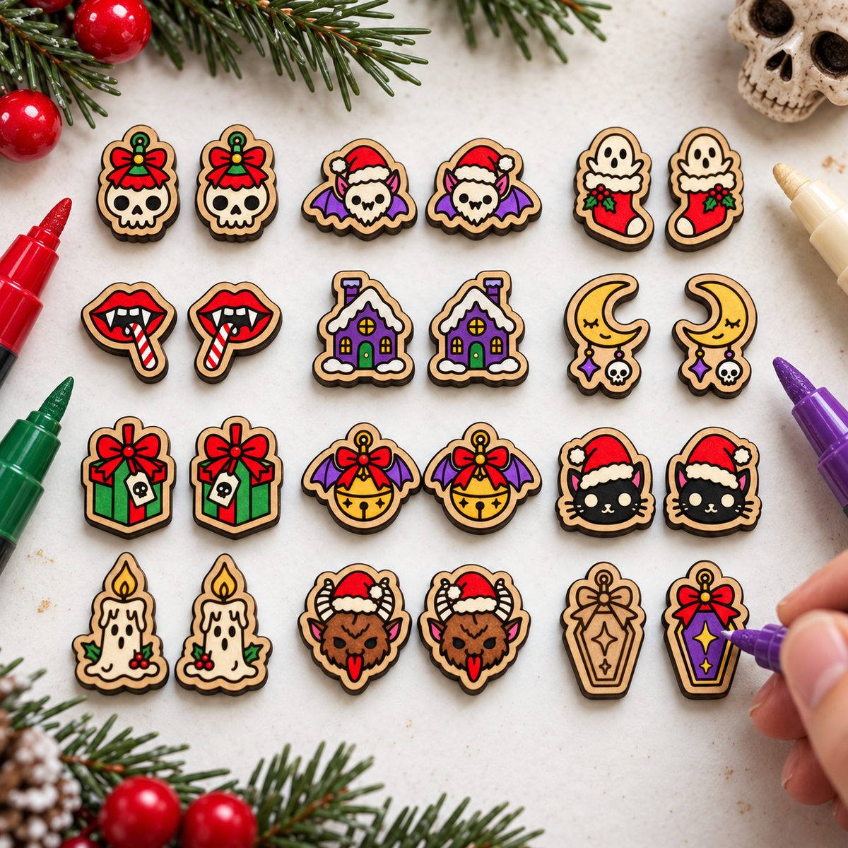 Horror Christmas stud earrings being colored with acrylic paint pens