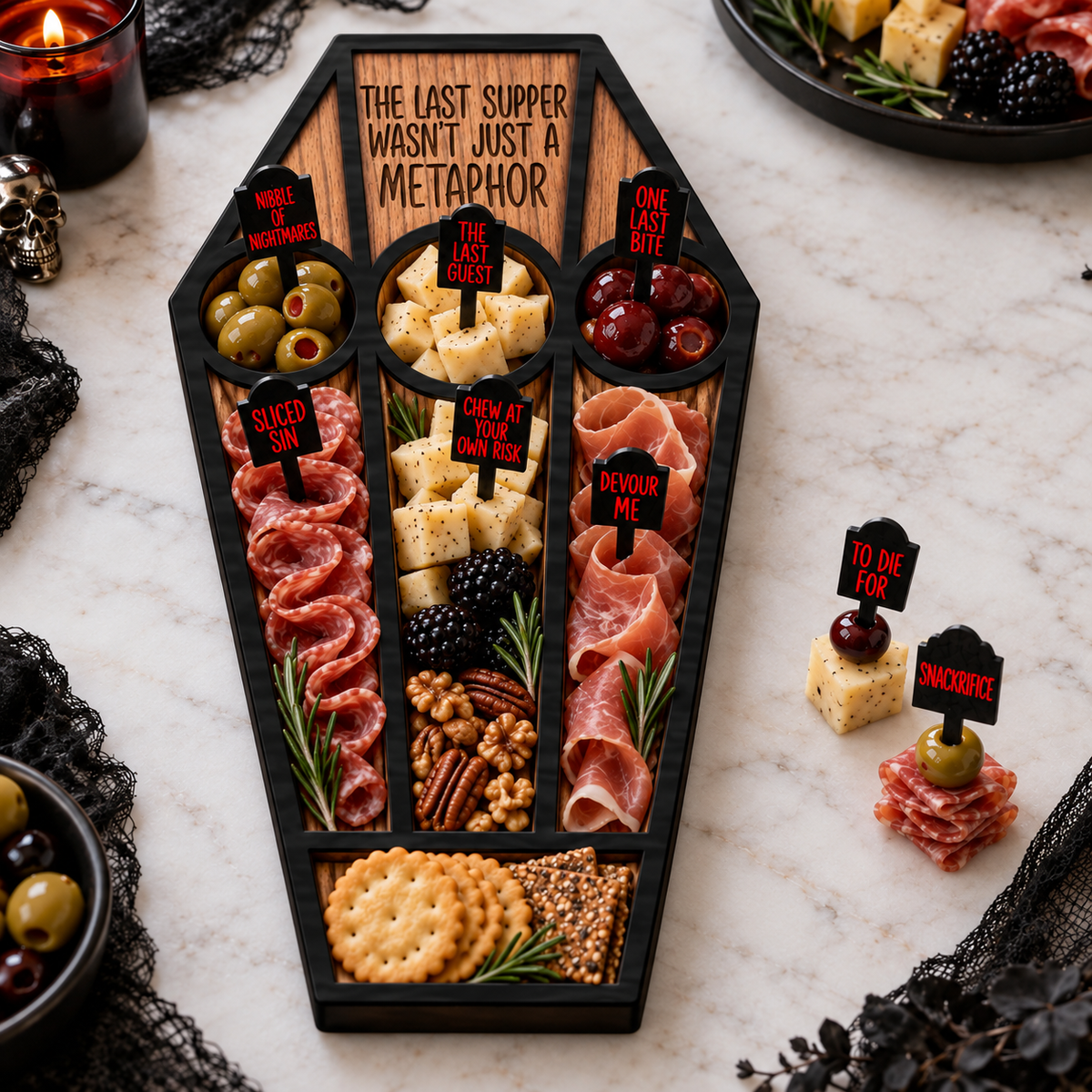Last Supper coffin charcuterie board filled with meats, cheeses, olives, crackers and horror acrylic food picks