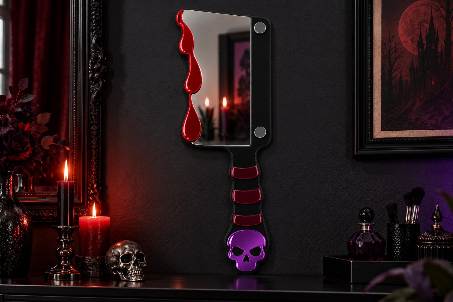 A gothic-style decorative wall mirror shaped like a cleaver, featuring a black blade with red dripping accents, a black handle with red stripes, and a purple skull at the end, displayed on a dark shelf in a moody room with candles and framed artwork.