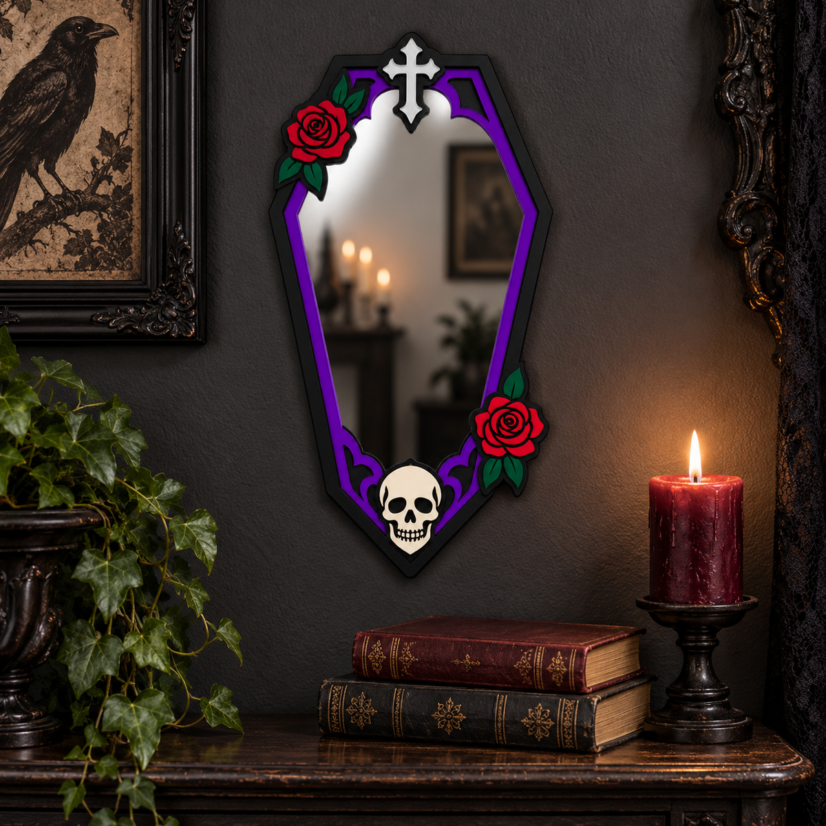 A gothic coffin-shaped wall mirror with a purple border, red roses, and a skull at the bottom, displayed on a dark wall above a mantel with candles, books, and a potted plant.